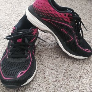 Black and fuchsia Asics running shoes